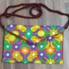 Red purse with blue,green and yellow flowers
